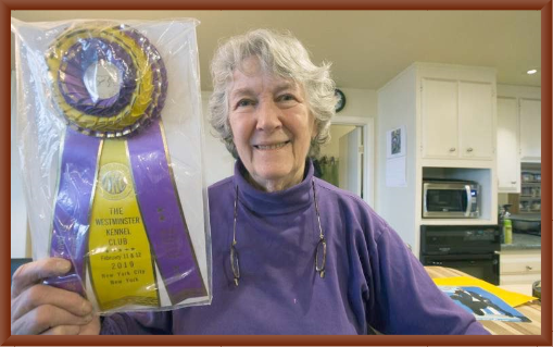 Julie Shows off Bernie's Westminster Best of Breed  Ribbon